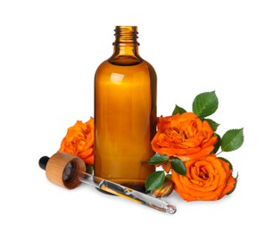 Photo of Bottle of rose essential oil and flowers on white background