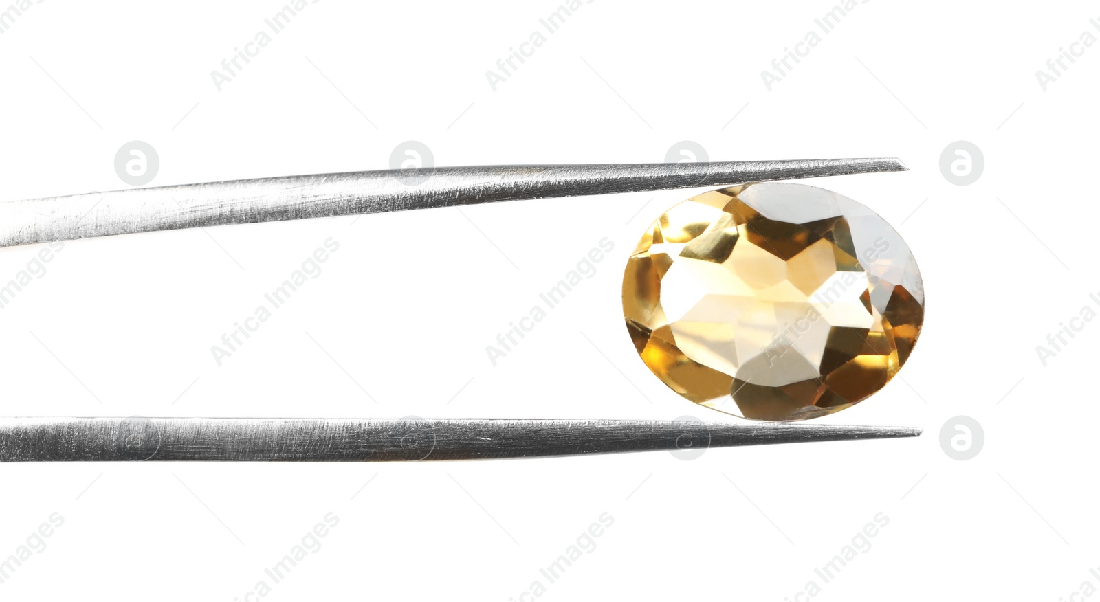 Photo of Tweezers with beautiful gemstone on white background