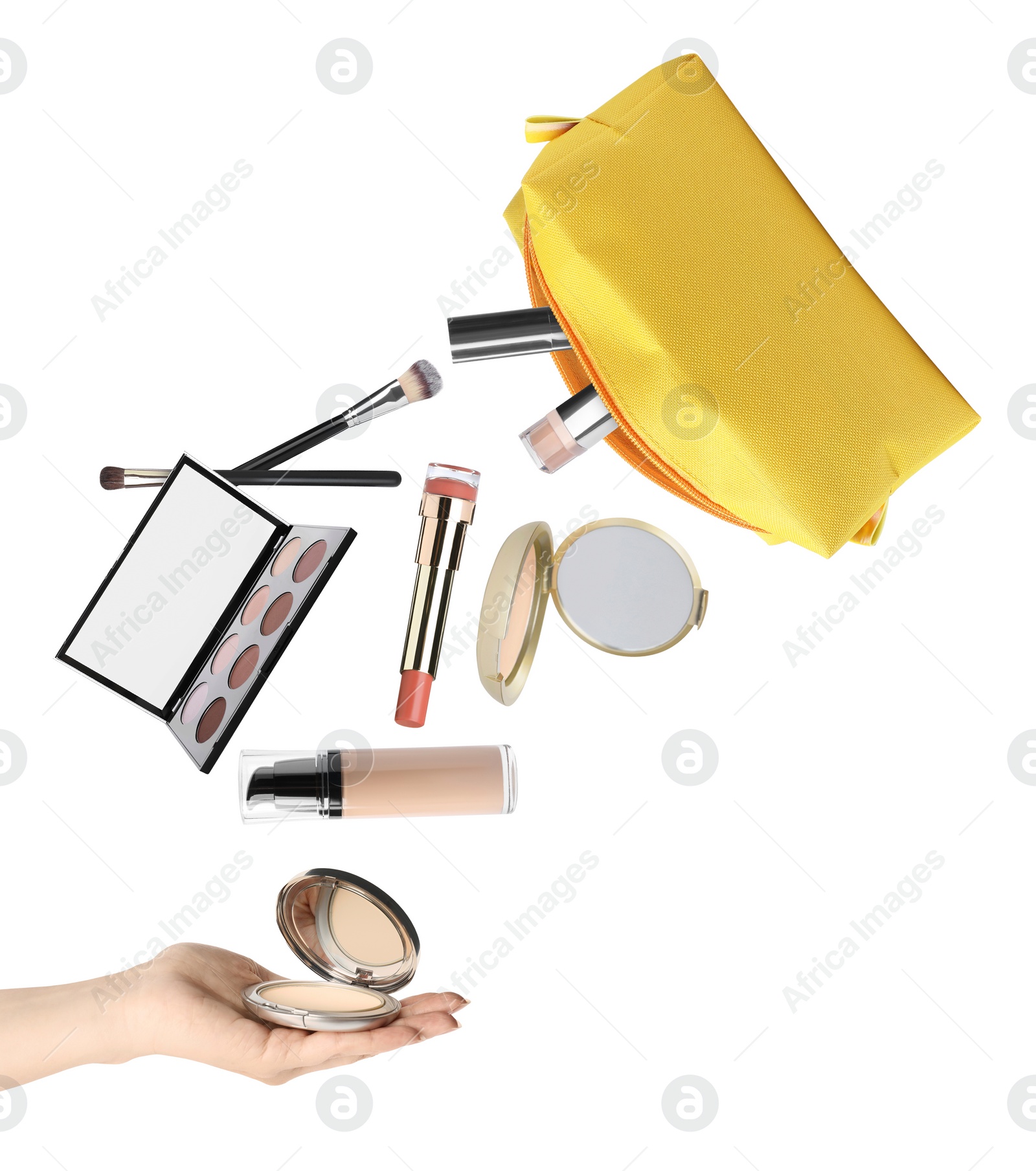 Image of Woman catching powder among falling makeup products from cosmetic bag on white background, closeup