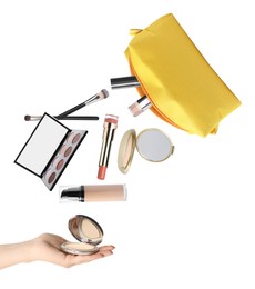 Woman catching powder among falling makeup products from cosmetic bag on white background, closeup