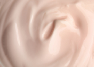 Photo of Tasty organic yogurt in bowl, top view