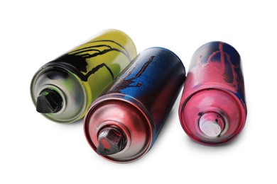 Photo of Used cans of spray paints on white background. Graffiti supplies