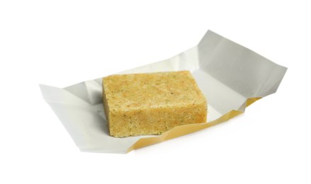 Photo of Unwrapped bouillon cube on white background. Broth concentrate