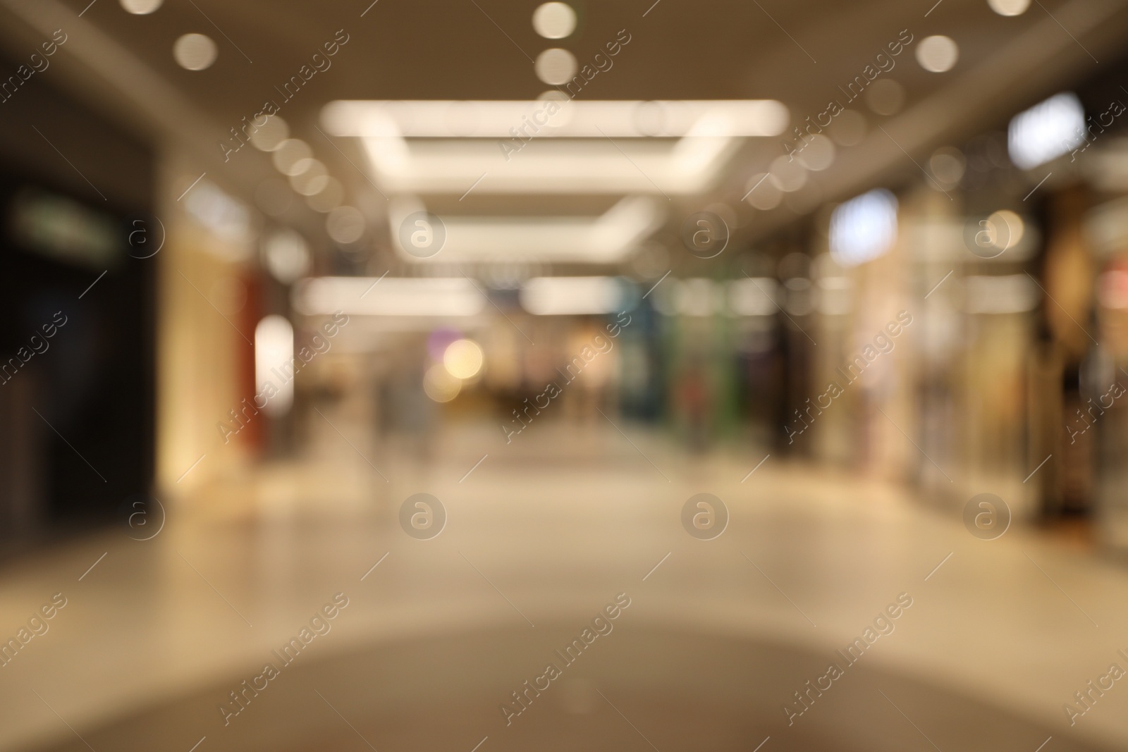 Photo of Blurred view of modern shopping mall interior. Bokeh effect