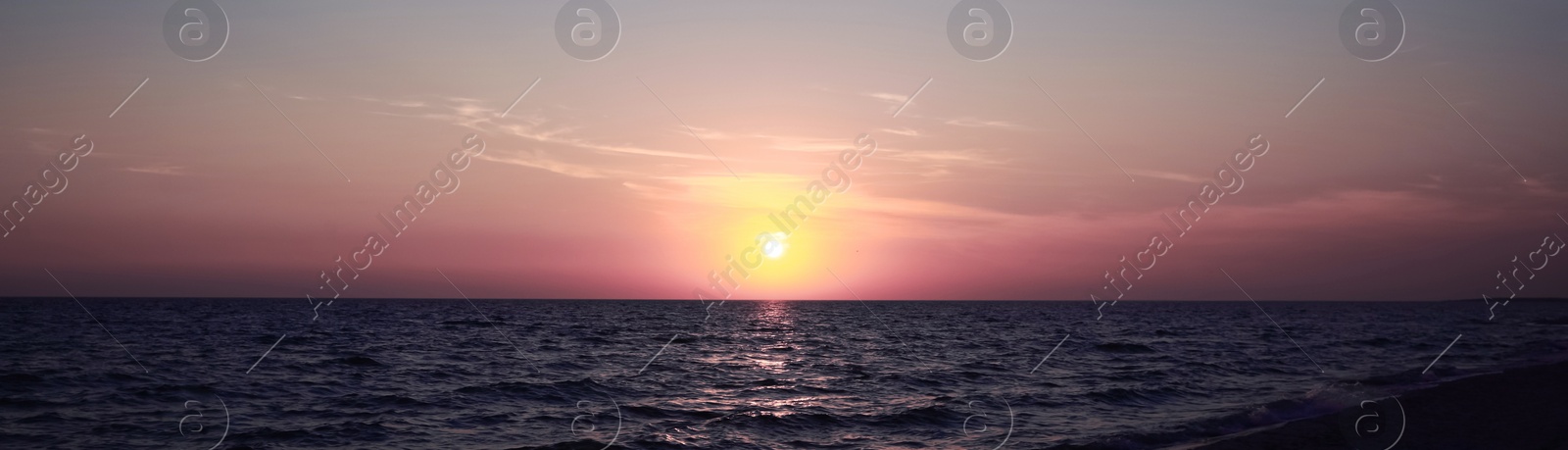 Image of Beautiful panorama of sky over sea at sunset. Banner design