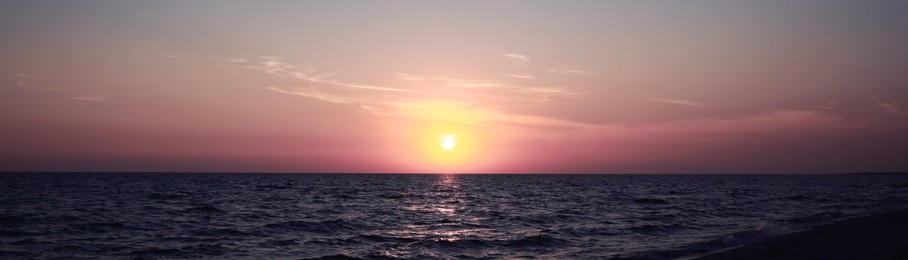 Beautiful panorama of sky over sea at sunset. Banner design