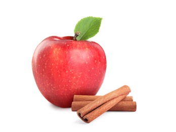 Aromatic cinnamon sticks and red apple isolated on white