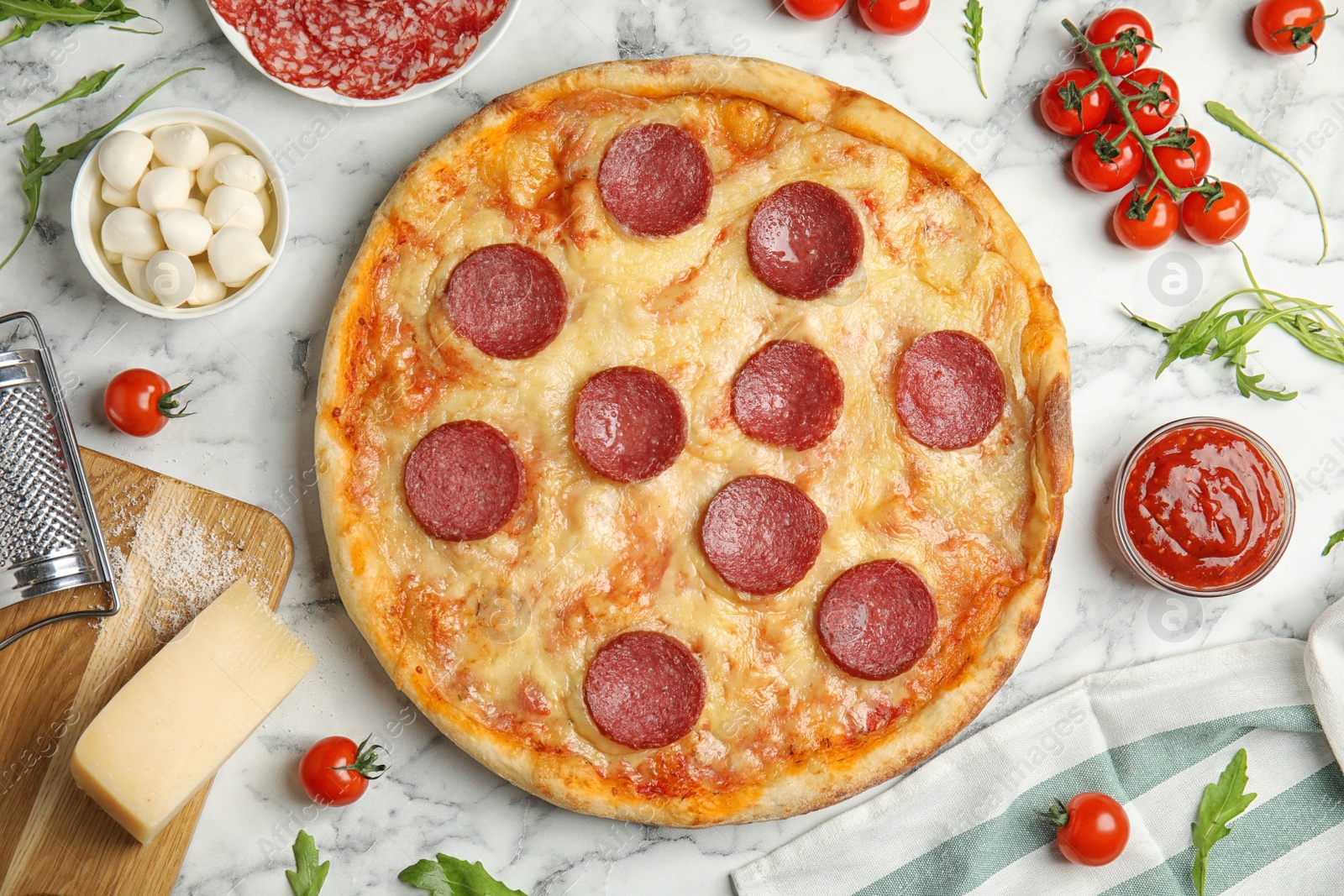 Photo of Flat lay composition with tasty pepperoni pizza on white marble table