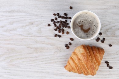 Photo of Coffee to go. Paper cup of tasty drink, croissant and beans on white wooden table, flat lay with space for text