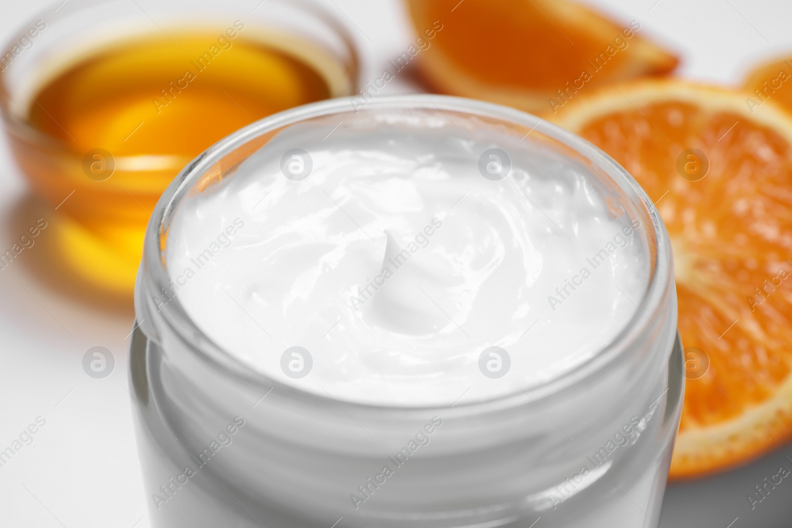 Photo of Jar of hand cream on blurred background, closeup