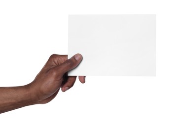 Photo of African American man holding sheet of paper on white background, closeup. Mockup for design