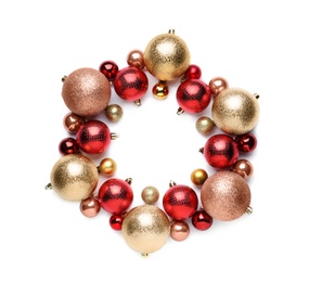 Beautiful Christmas wreath made of shiny baubles on white background, top view