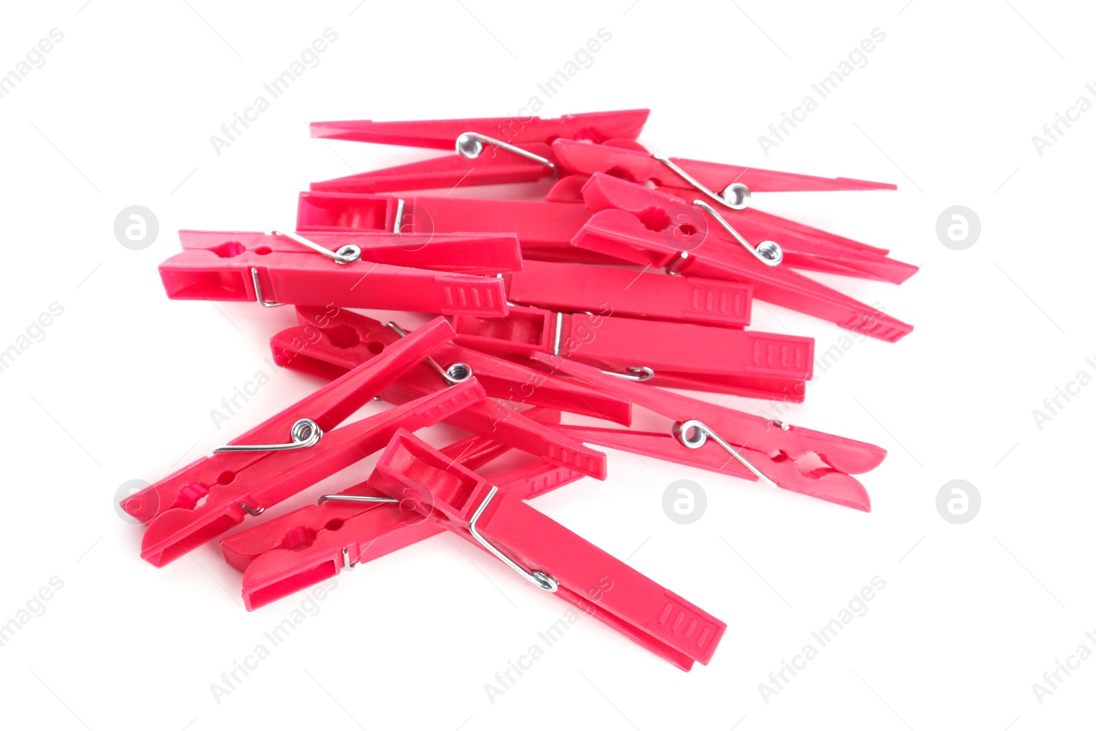 Photo of Bright pink plastic clothespins on white background, above view