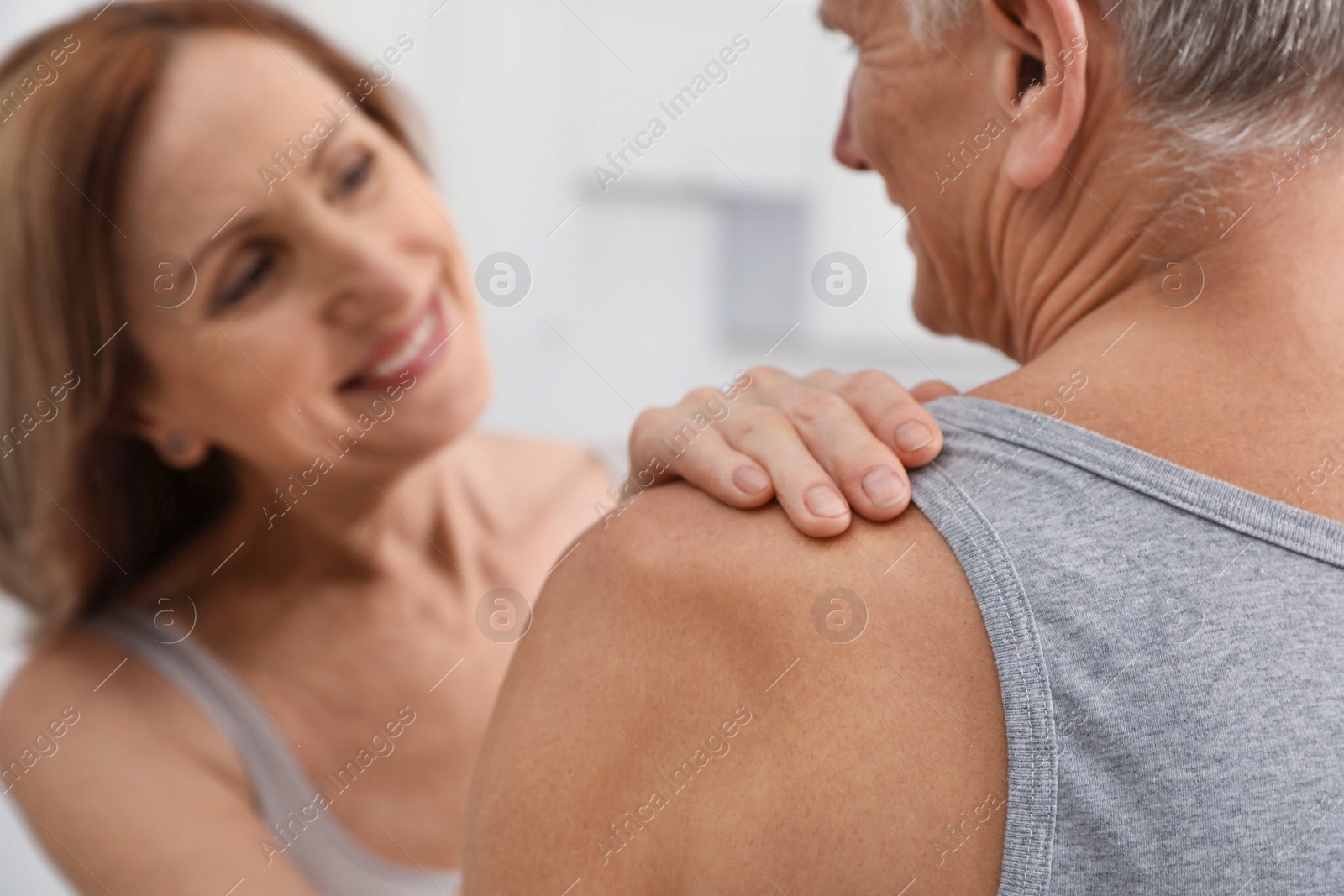 Photo of Happy senior couple dancing together at home, closeup