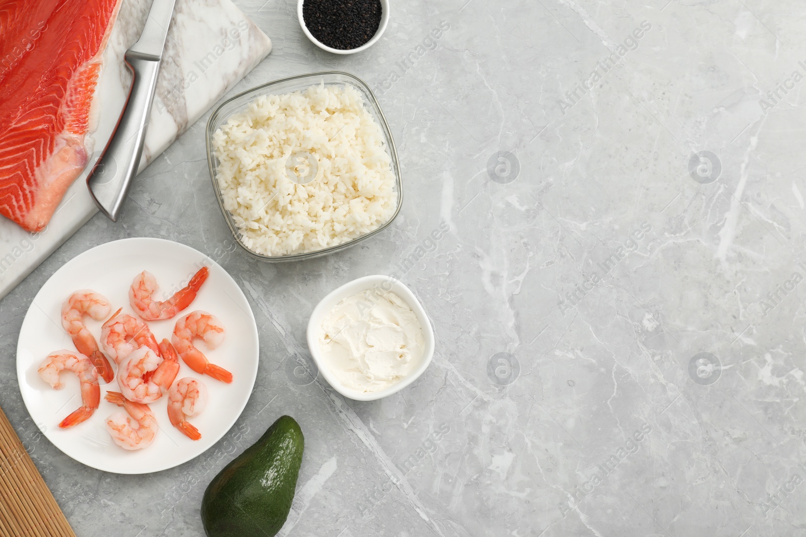 Photo of Flat lay composition with ingredients for sushi on grey marble table. Space for text