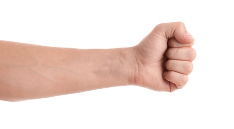 Man showing fist on white background, closeup of hand