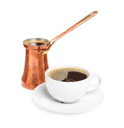 Copper turkish coffee pot and cup of hot drink on white background