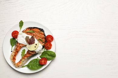 Tasty salmon steak served on white wooden table, top view. Space for text