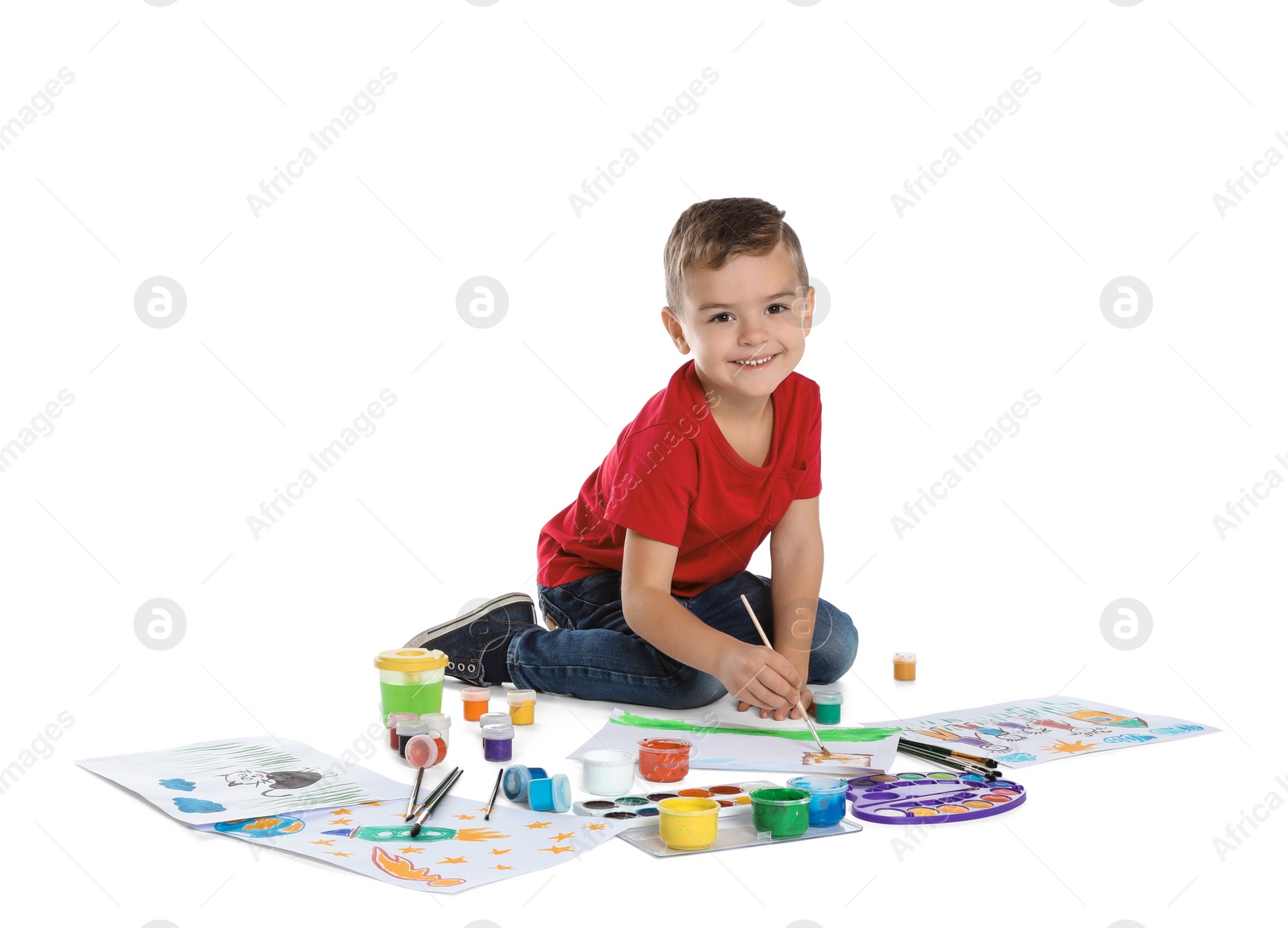 Photo of Cute child painting picture on white background