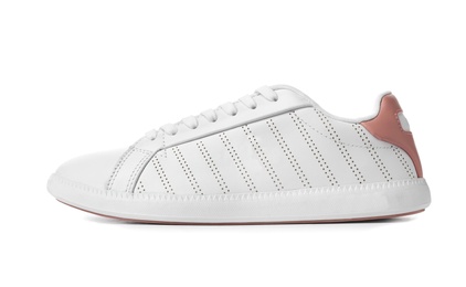 Photo of New trendy woman's sneaker on white background