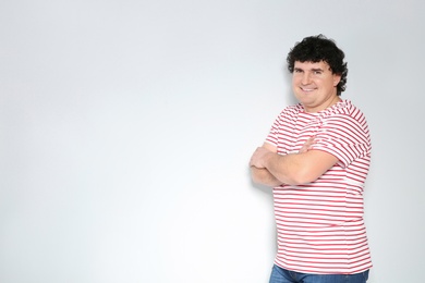 Portrait of handsome mature man posing on white background