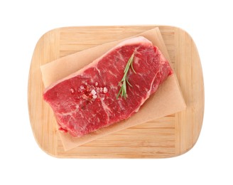 Photo of Board with steak of raw beef meat and spices isolated on white, top view