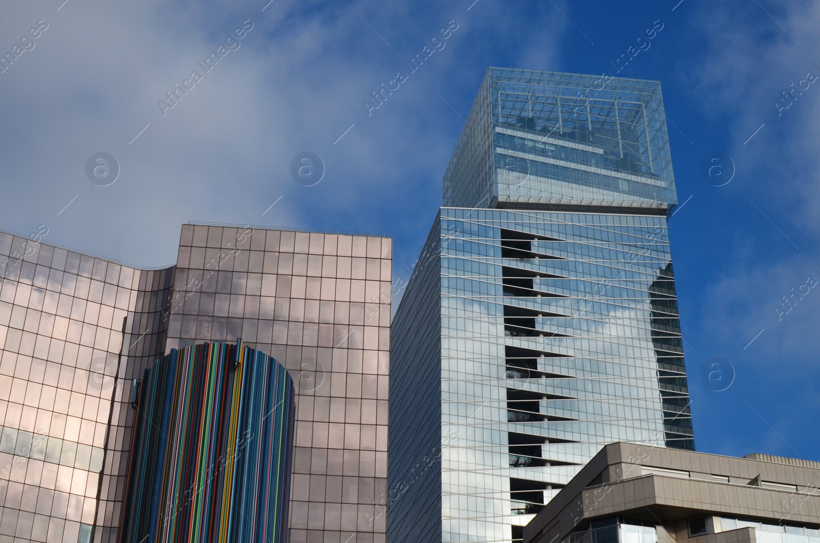 Photo of Exterior of different modern skyscrapers against blue sky