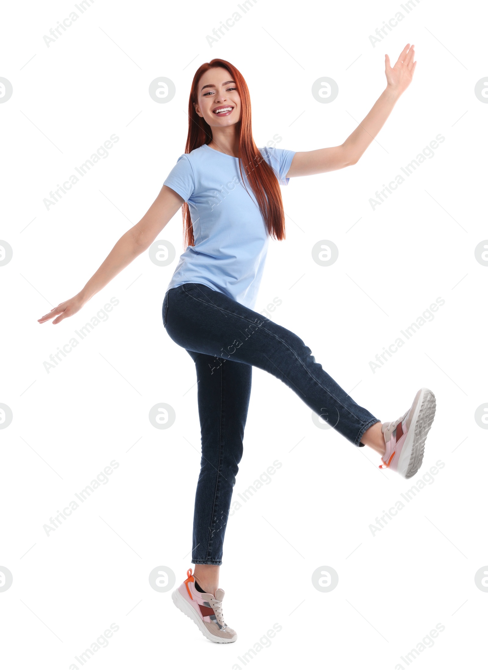 Photo of Happy woman with red dyed hair having fun on white background