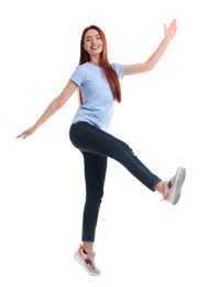 Happy woman with red dyed hair having fun on white background