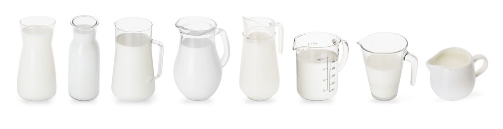 Image of Fresh milk in jugs isolated on white, set