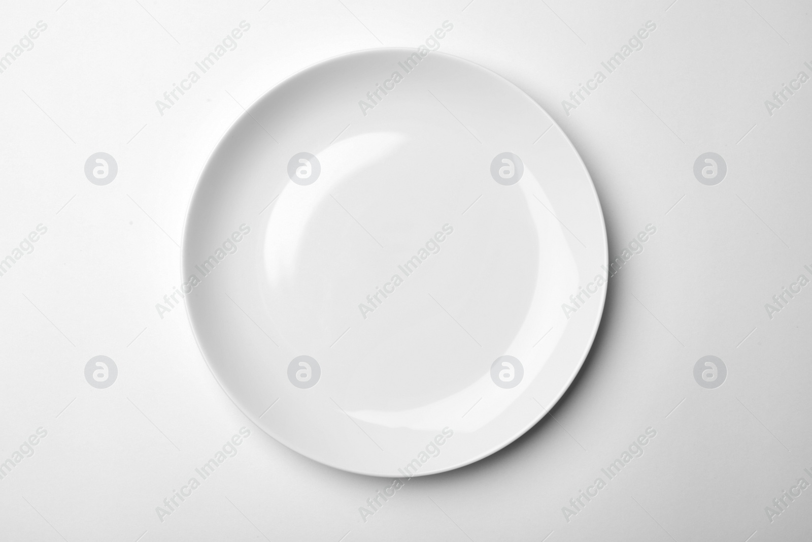 Photo of Clean empty plate on white background, top view