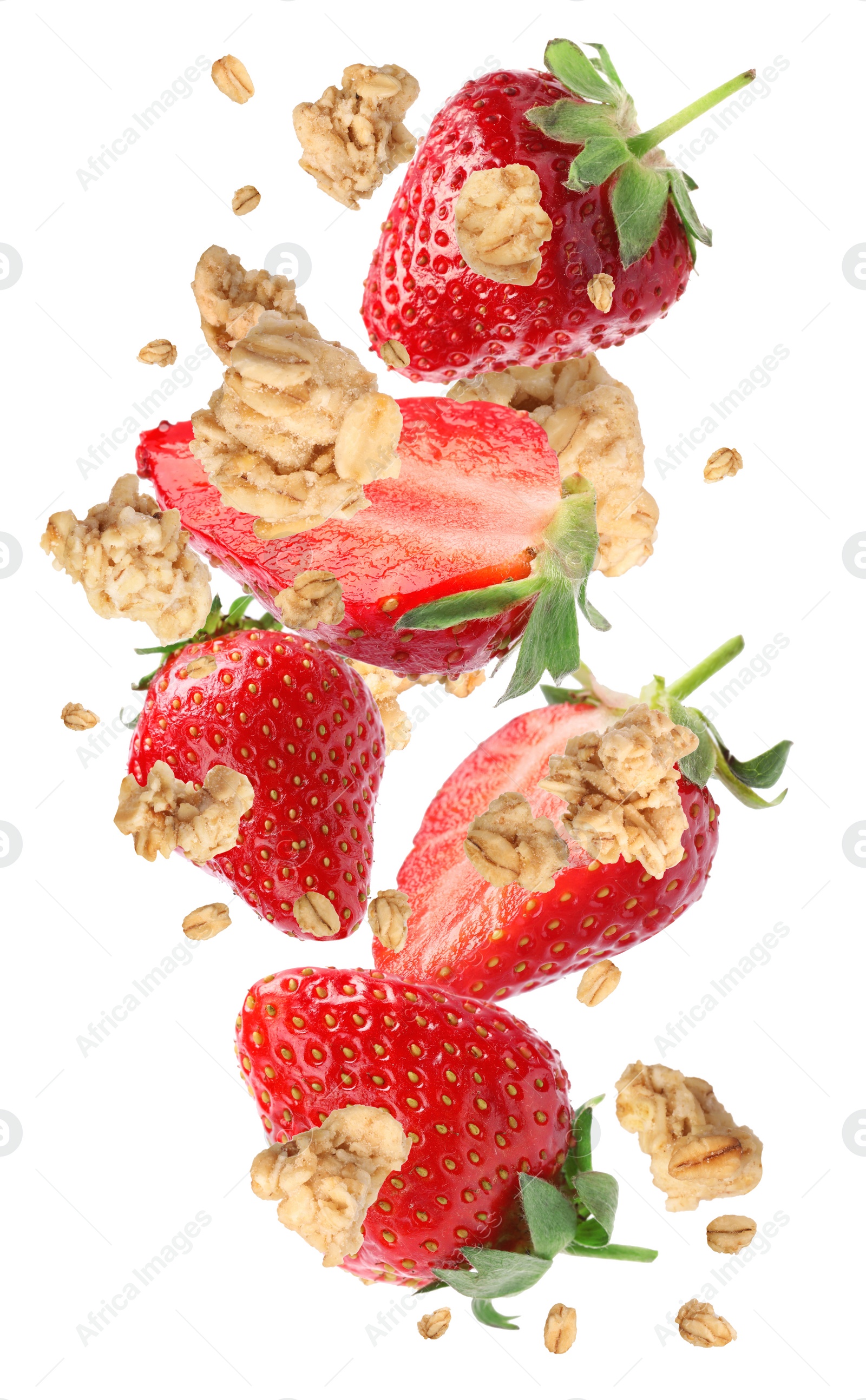 Image of Delicious granola and strawberries falling on white background. Healthy snack  