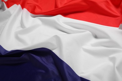 Photo of Flag of Netherlands as background, closeup. National symbol