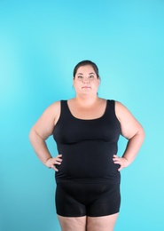 Overweight woman before weight loss on color background