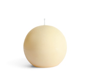 Photo of New round wax candle on white background