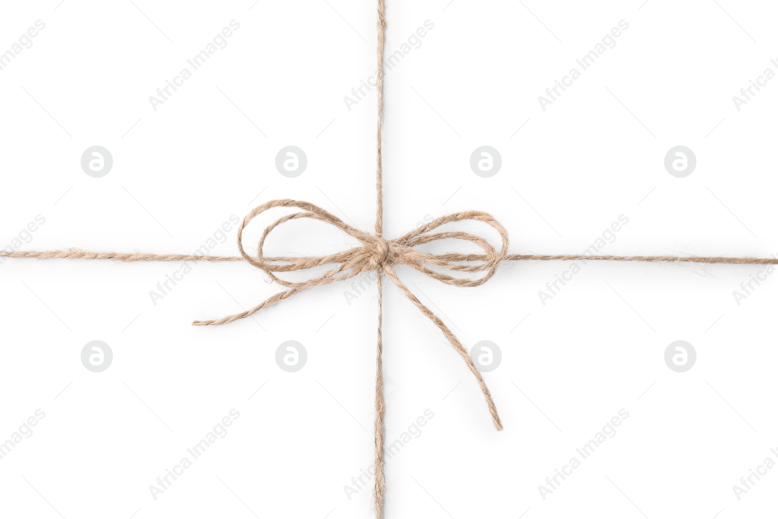 Photo of Linen rope string with bow isolated on white, top view