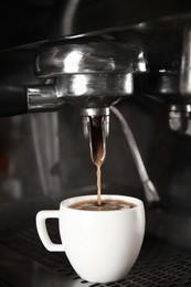 Photo of Making fresh aromatic espresso using professional coffee machine