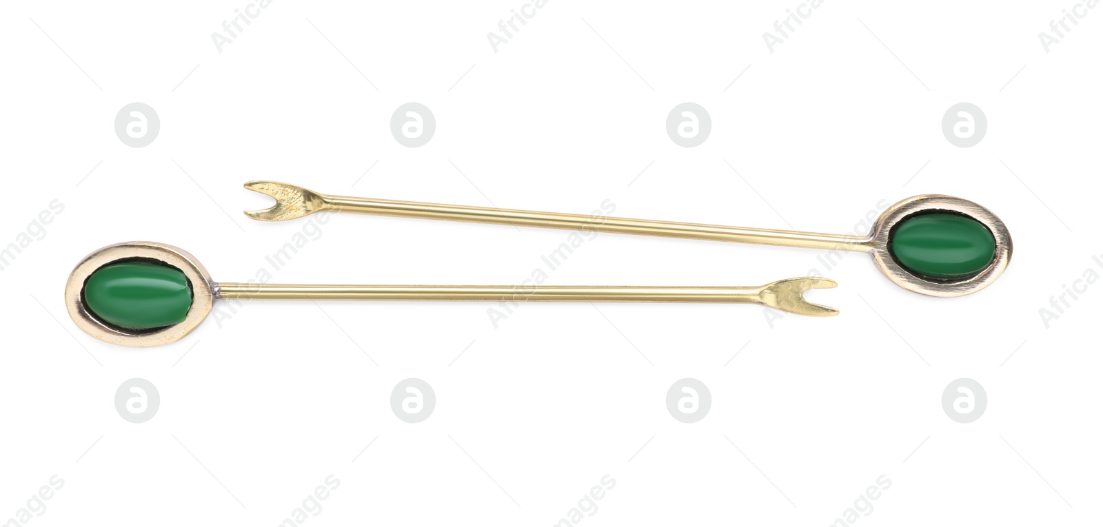 Photo of New stylish forks for canapes on white background, top view