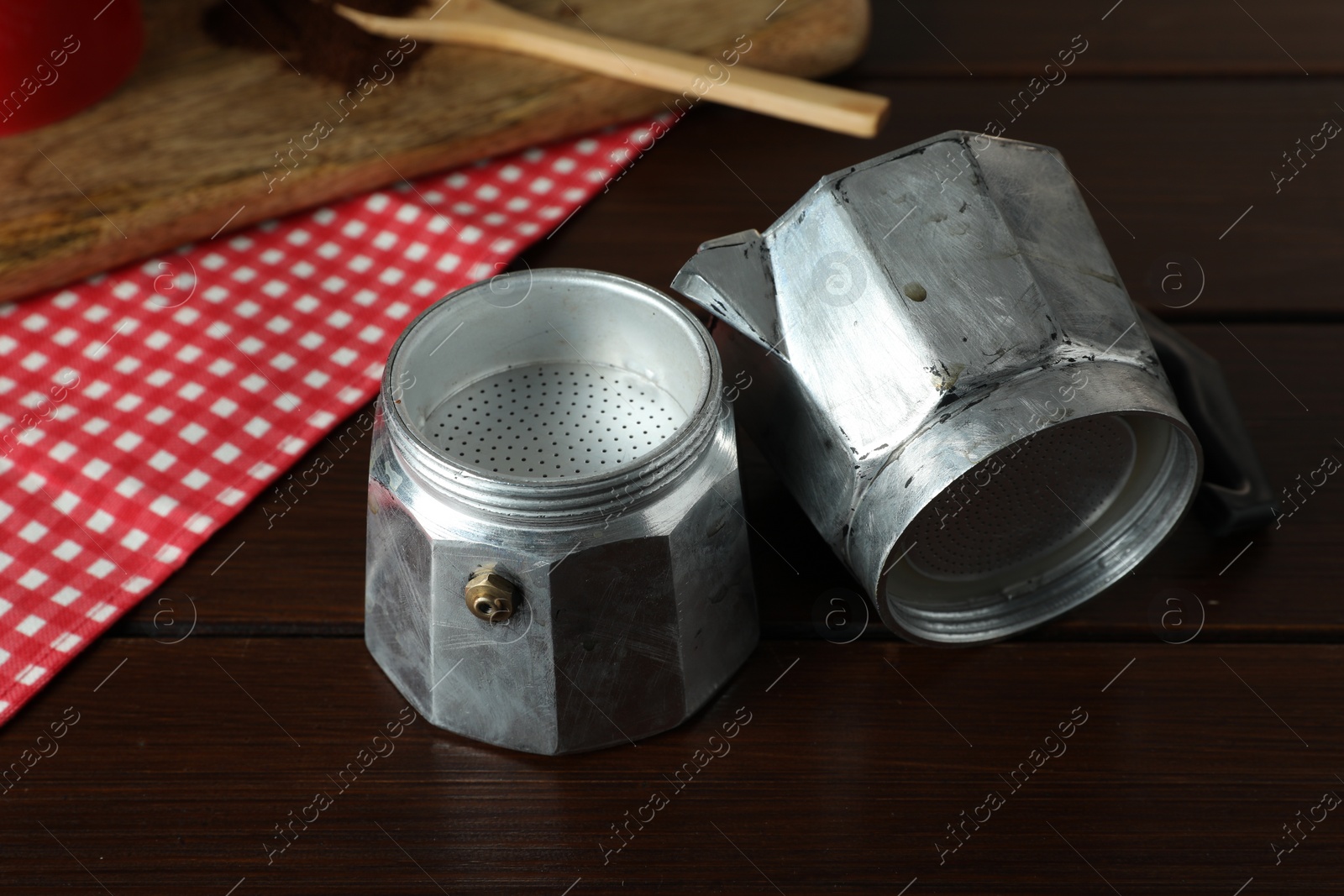 Photo of One coffee moka pot on wooden table