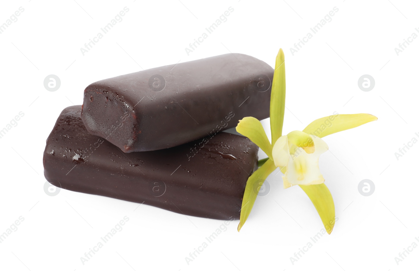 Photo of Glazed curd cheese bars and vanilla flower isolated on white