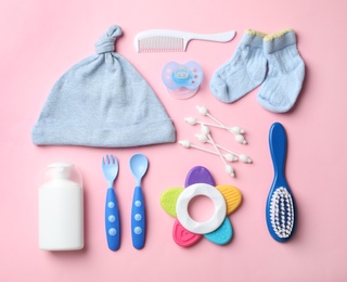 Photo of Flat lay composition with baby accessories on color background