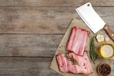 Photo of Flat lay composition with raw ribs, products and space for text on wooden background. Fresh meat