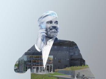 Image of Double exposure of businessman talking on phone and cityscape