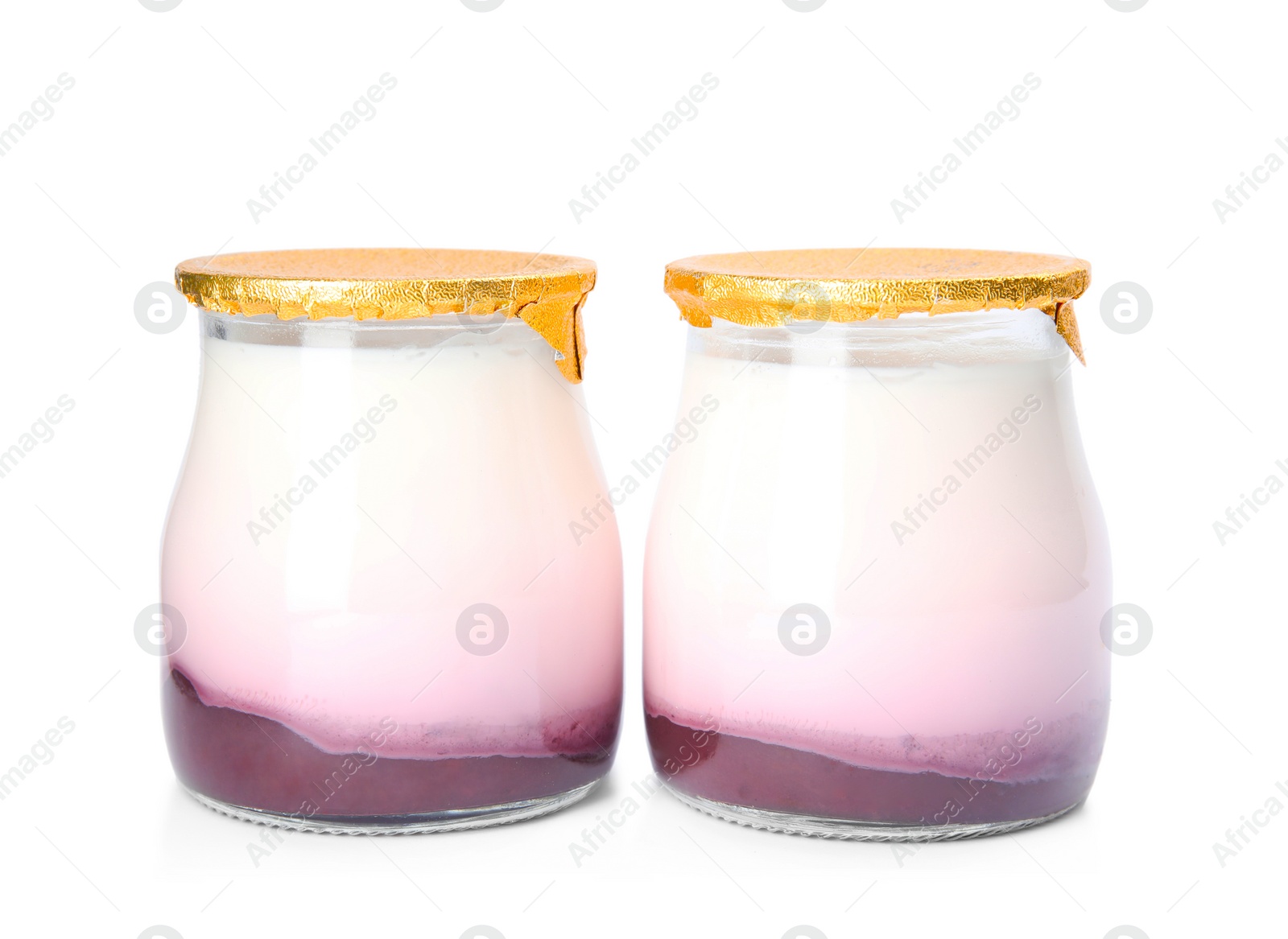 Photo of Glass jars of tasty fruit yogurt on white background