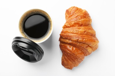 Photo of Delicious fresh croissant and paper cup of coffee on white background, flat lay