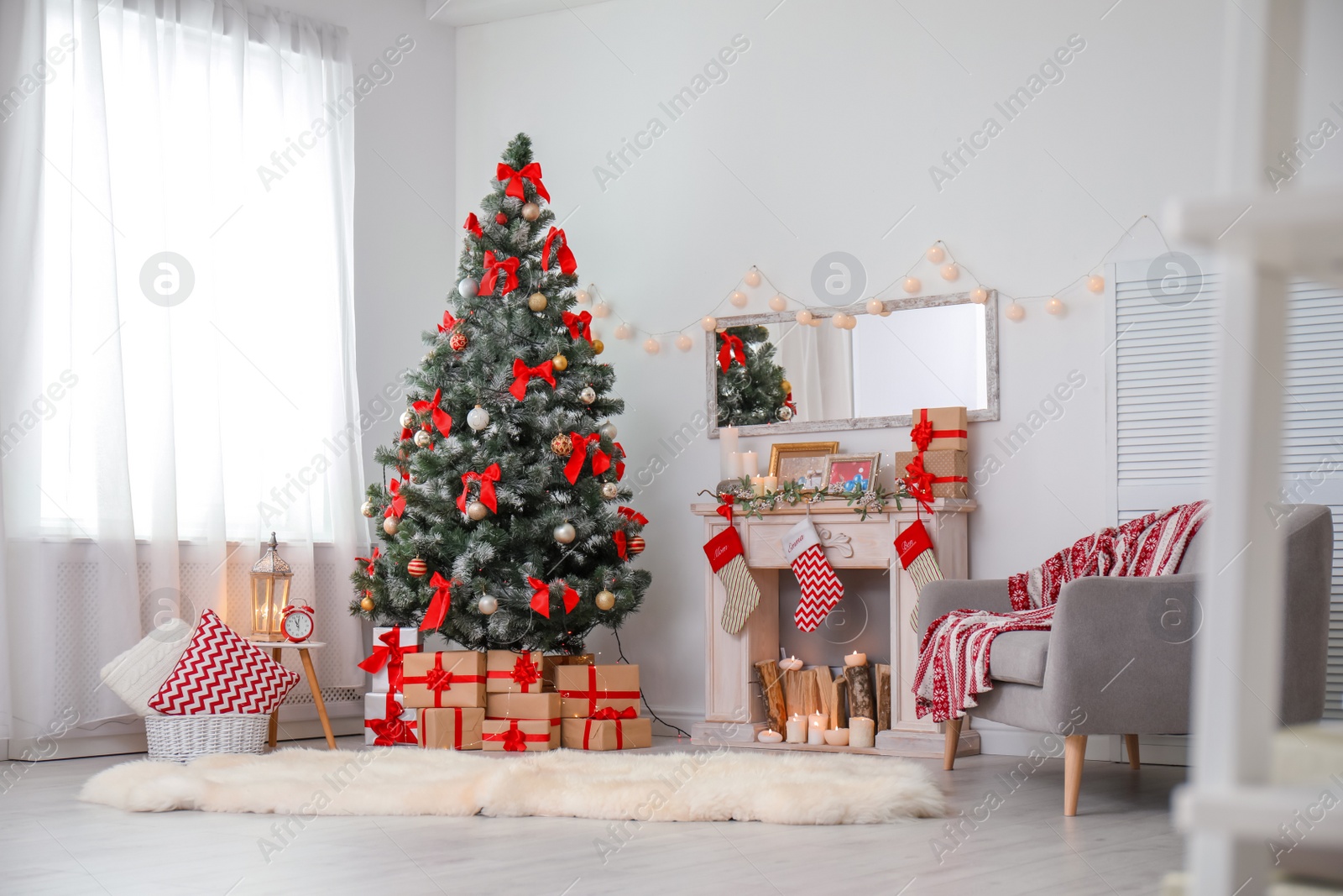 Photo of Stylish living room interior with decorated Christmas tree