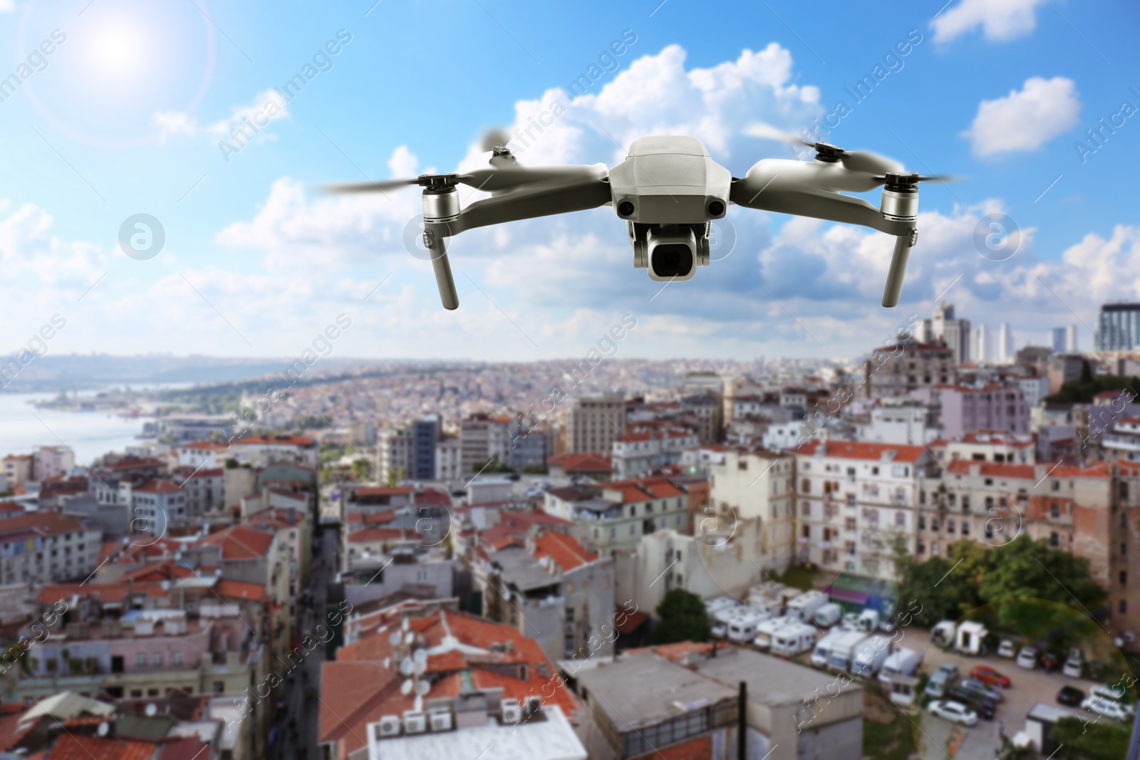 Image of Modern drone flying over city. Aerial survey