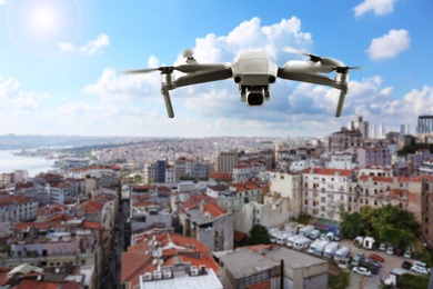 Image of Modern drone flying over city. Aerial survey