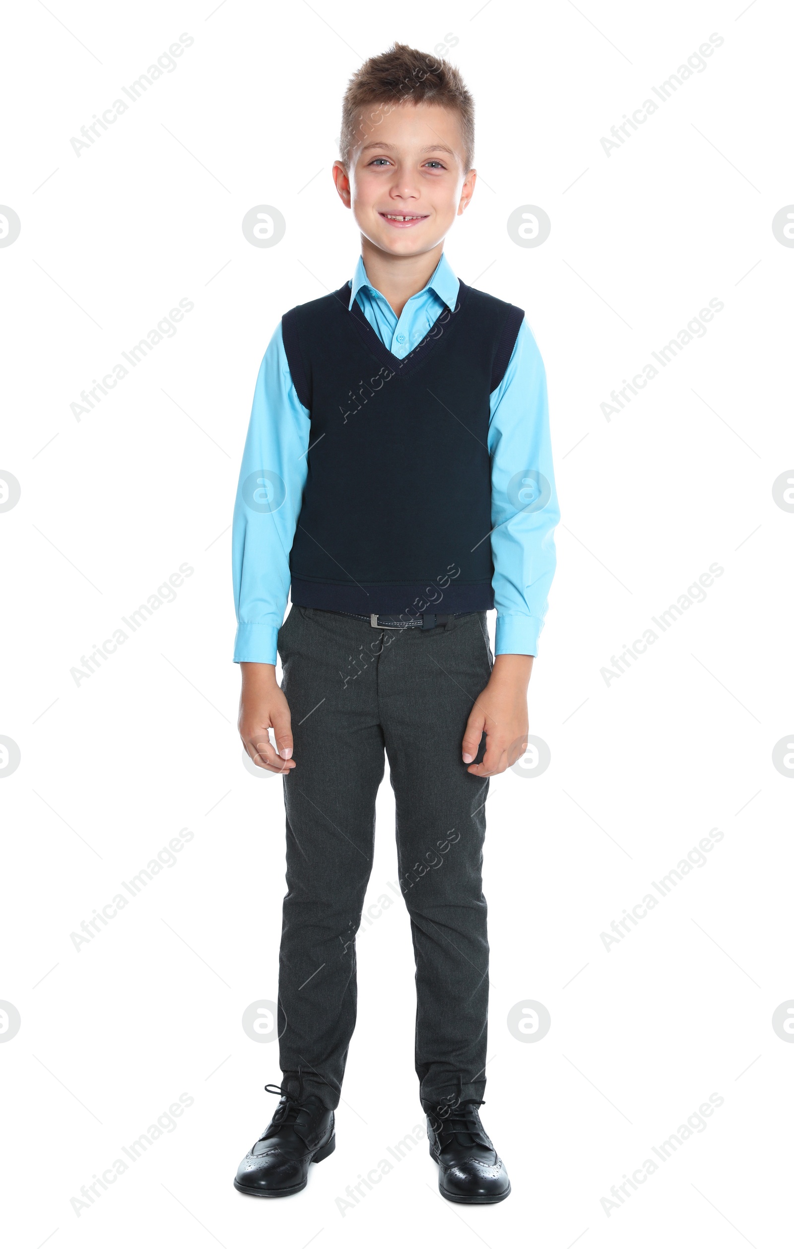 Photo of Happy boy in school uniform on white background