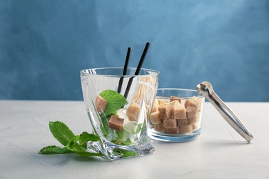 Photo of Composition with ingredients for mint julep cocktail on table